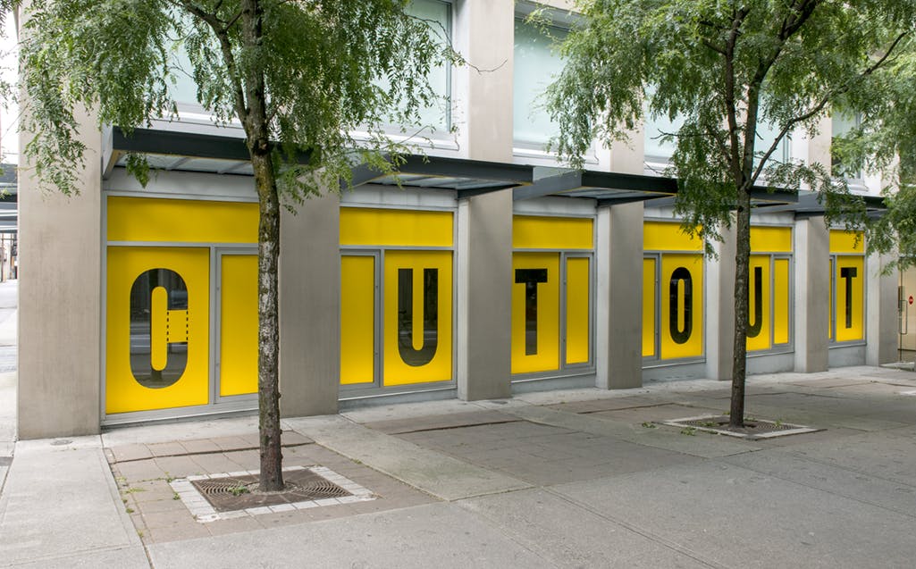 Kay Rosen’s text-based work is installed on CAG’s exterior windows. Yellow vinyl sheets cover the windows. In each window, a letter from the word “CUTOUT” has been excised from the vinyl. 