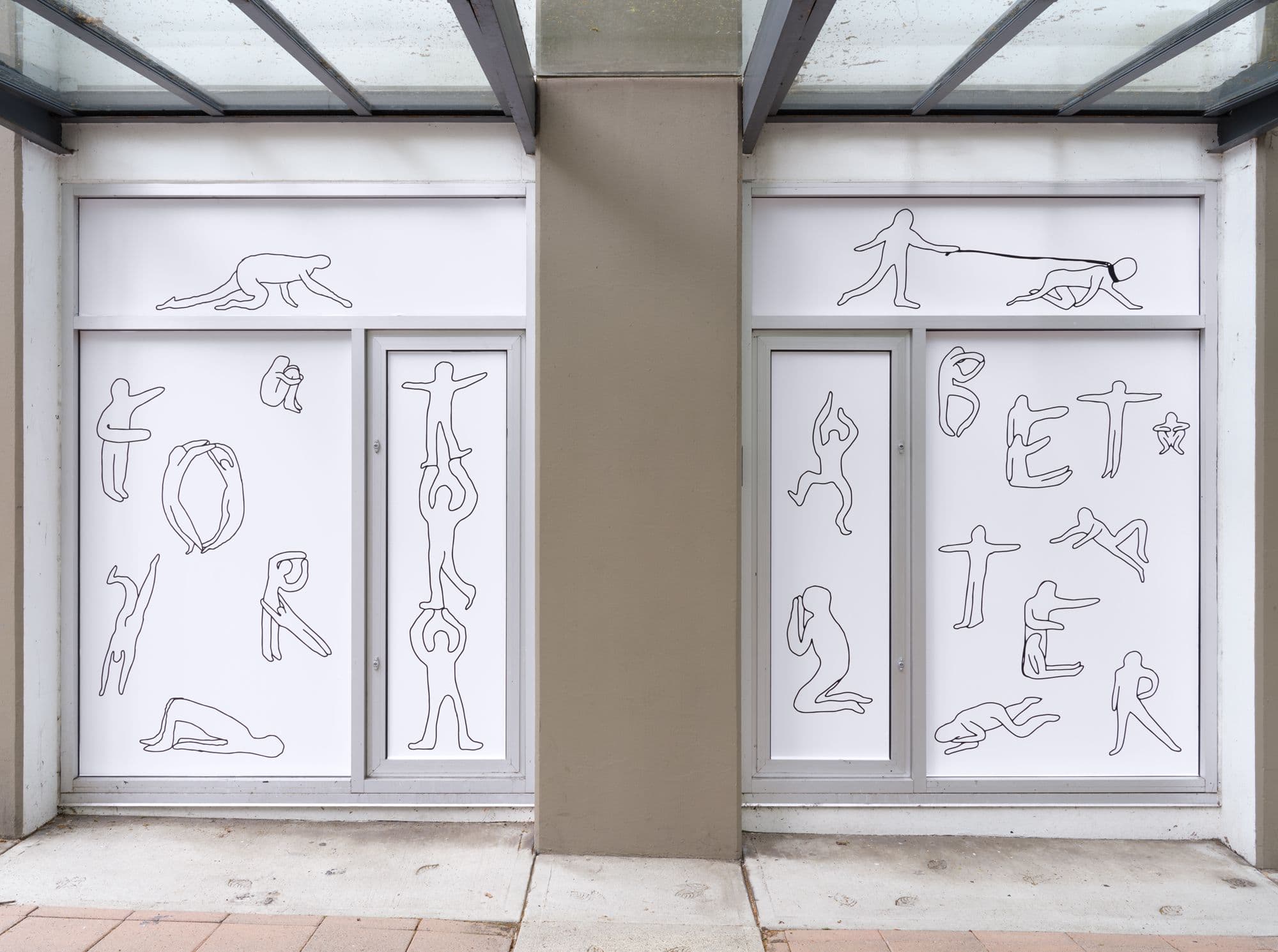 A pair of windows featuring line drawn figures engaged in various activities. Some of the figures spell out “for” and “better” with their bodies.