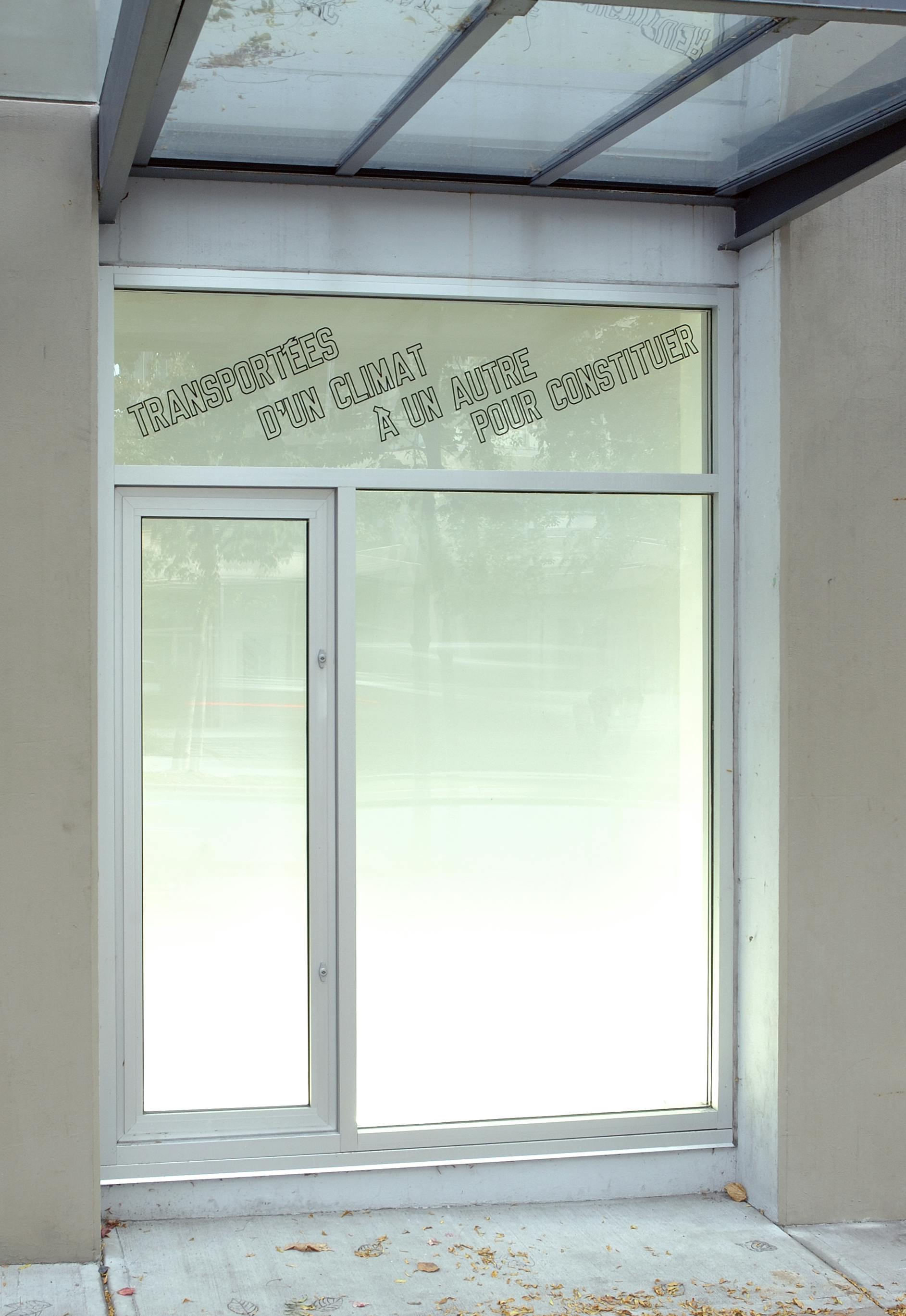 One of the windows on CAG’s facade displays a text-based artwork. It reads, “transportées d’un climat à un autre pour constituer” in upper letters.