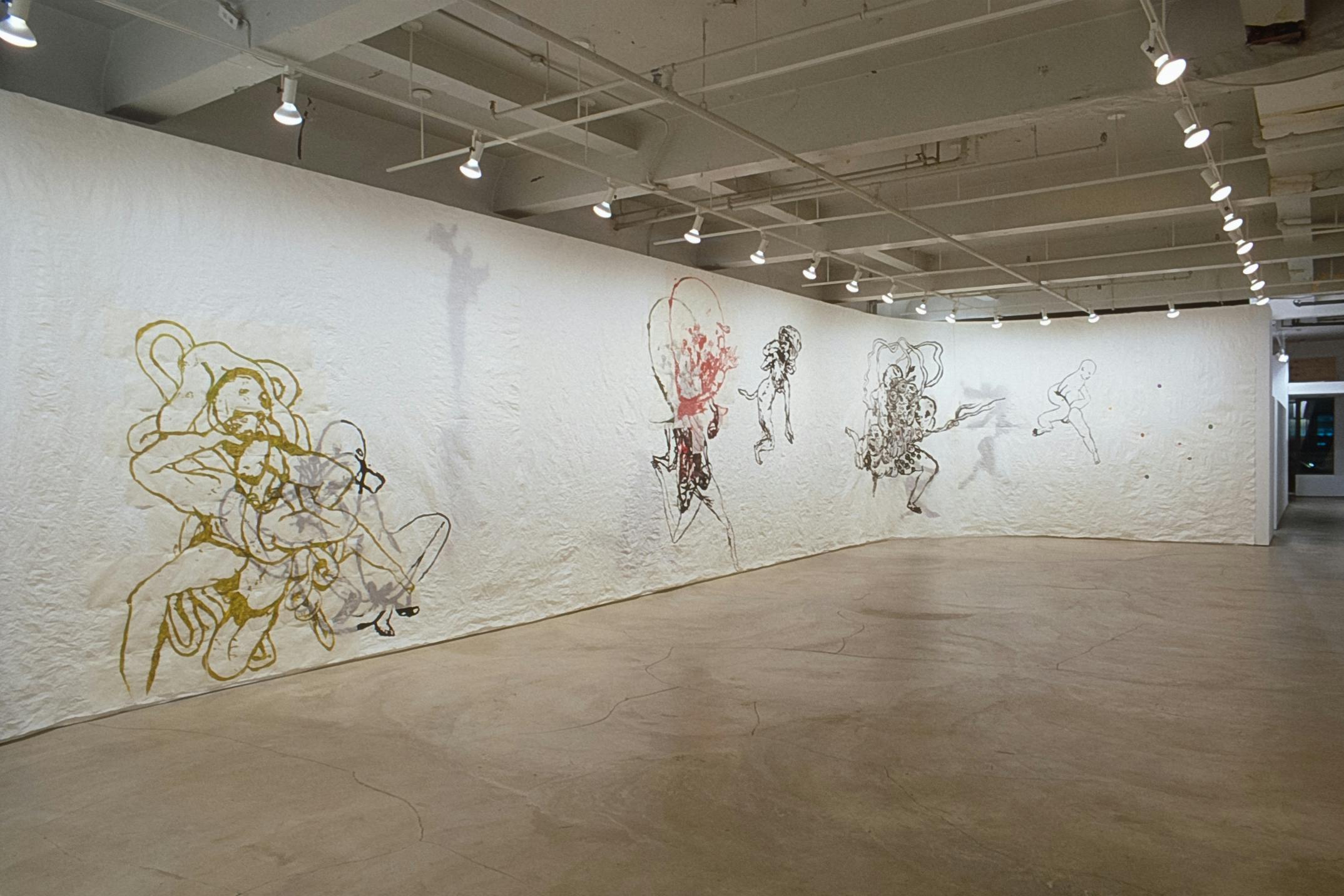 Gallery walls are covered by a wide white scroll of paper, on which Ed Pien’s drawings are made. All of the drawn figures are layered and highly abstracted. All the figures have human legs.