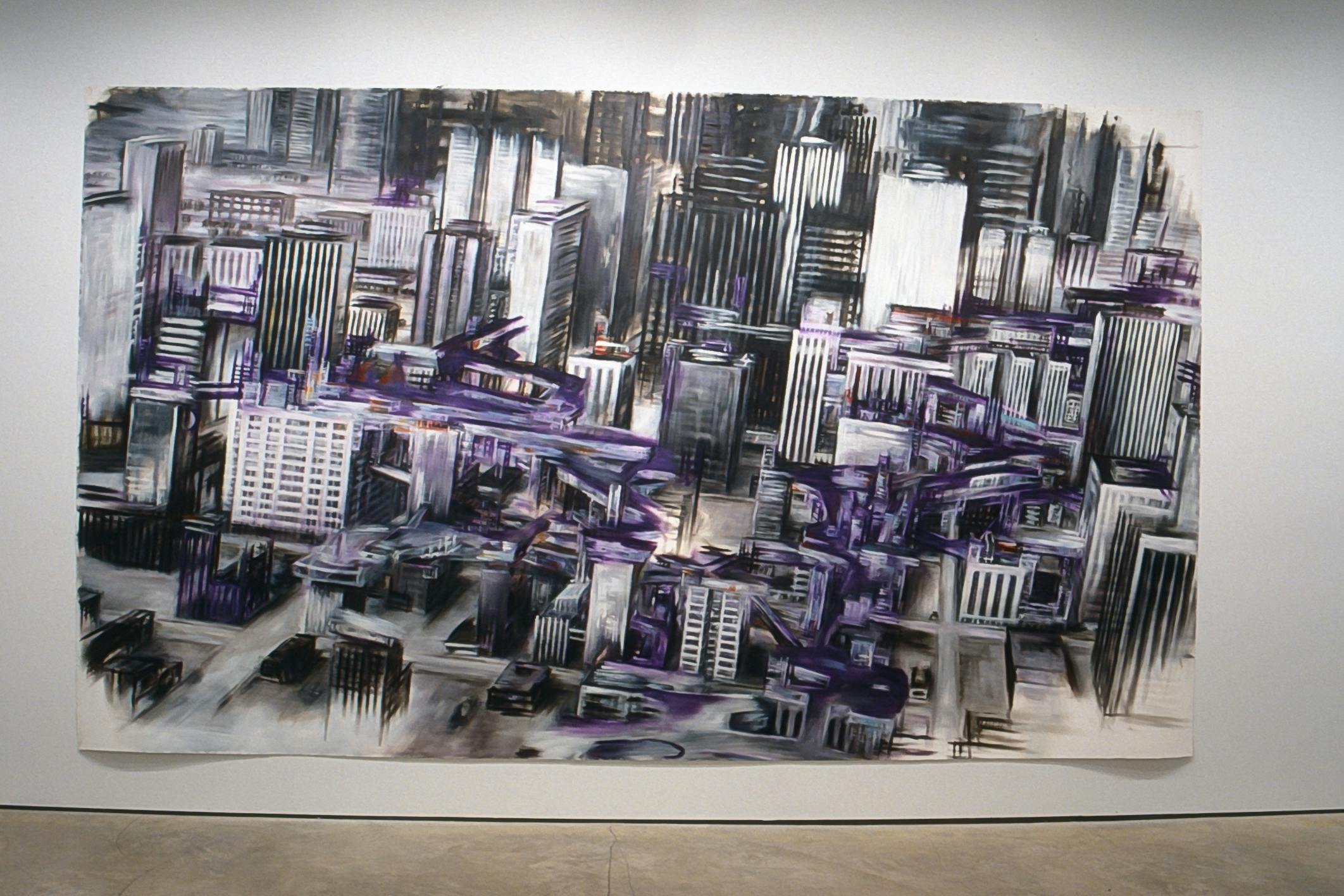 A large-scale painting is installed on the gallery wall. It depicts an aerial view of an urban city where purple highways run between skyscrapers. The buildings are slightly tilted to the right angle. 