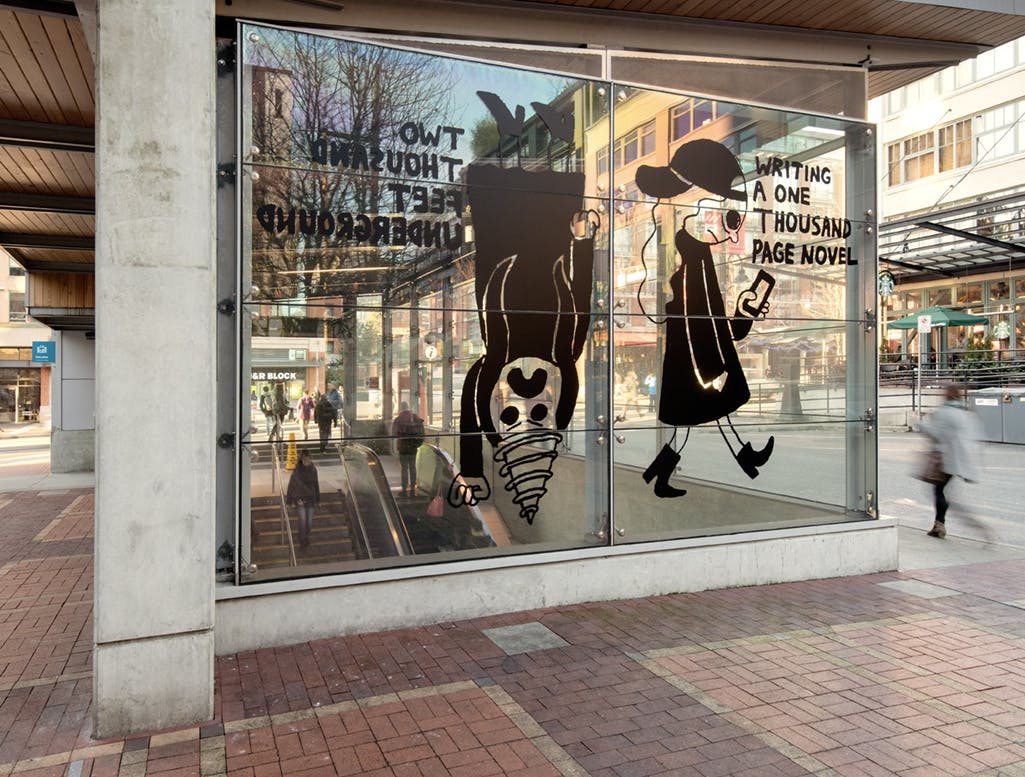 A graphic illustration of two figures printed in black vinyl on the glass face of a train station. One is walking and the other is upside down with a drill-like head. Bold text is on either side.