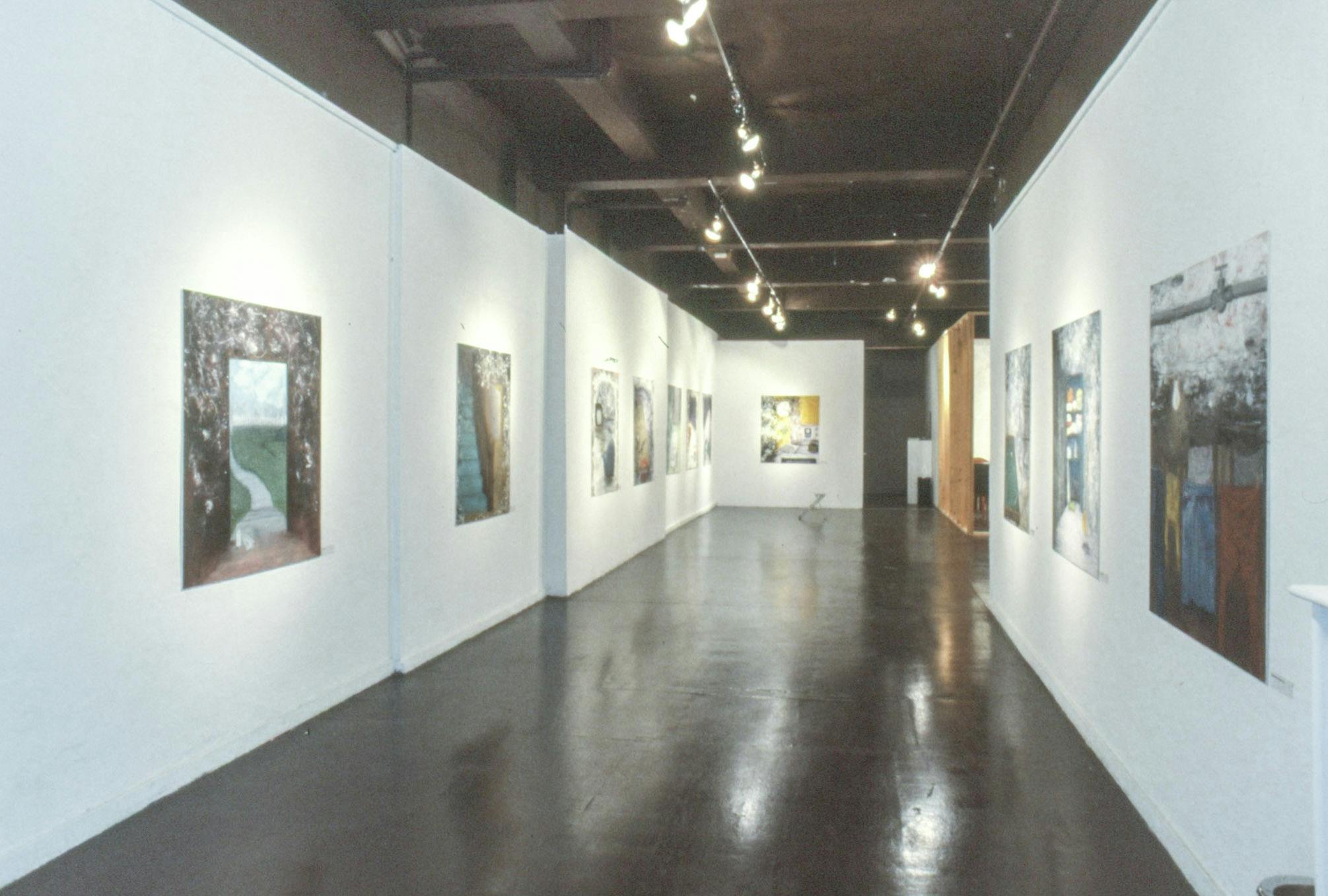 Several paintings on paper line the walls of a gallery. They depict different scenes and landscapes including a clothesline, an entryway with the view of a hill, a stairway, and a supply closet.