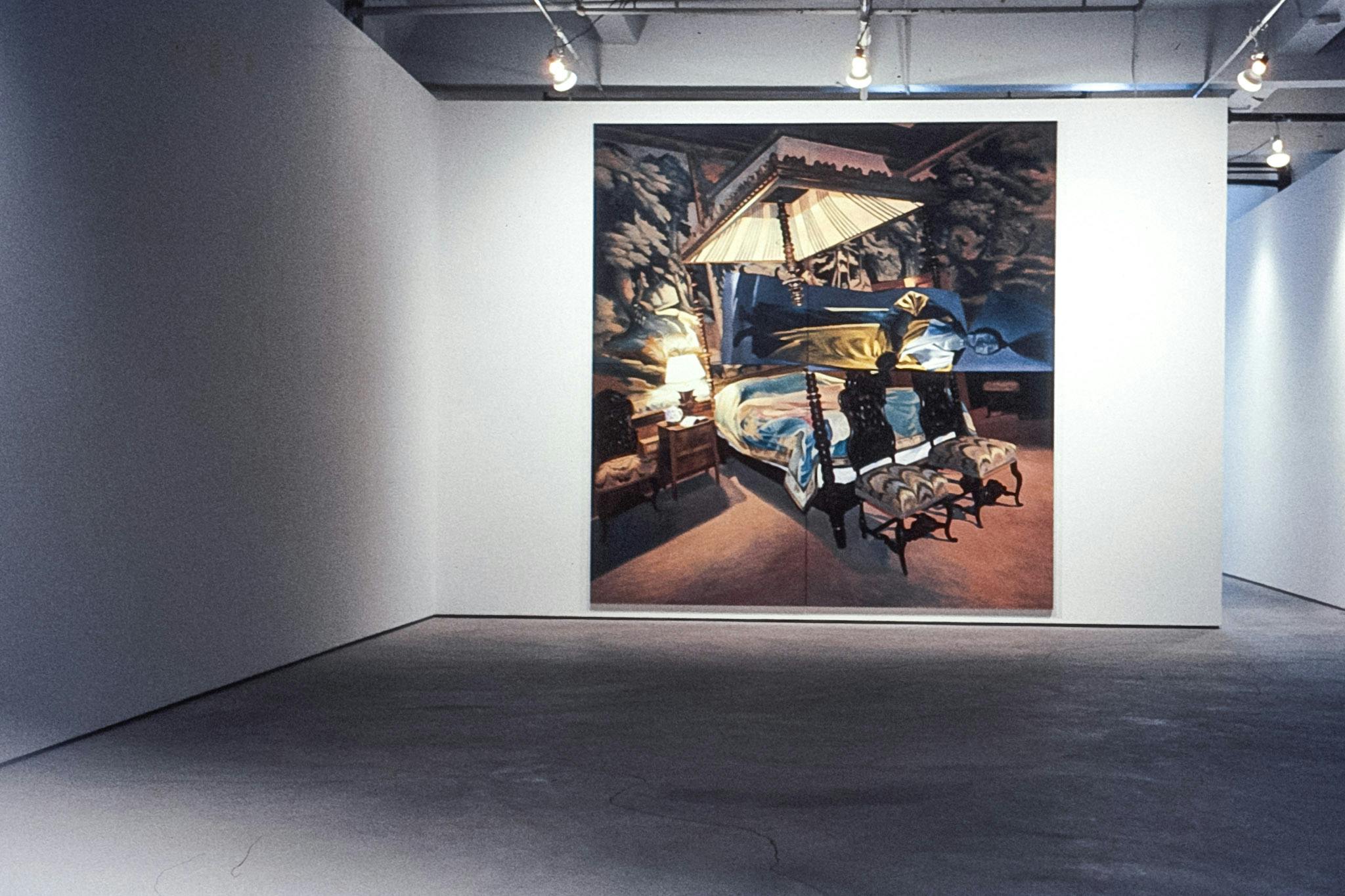 The corner of a gallery space, with a painting on the wall. The painting is nearly the same height as the wall, and shows a dark bedroom, painted at an angle which creates a disorienting experience. 