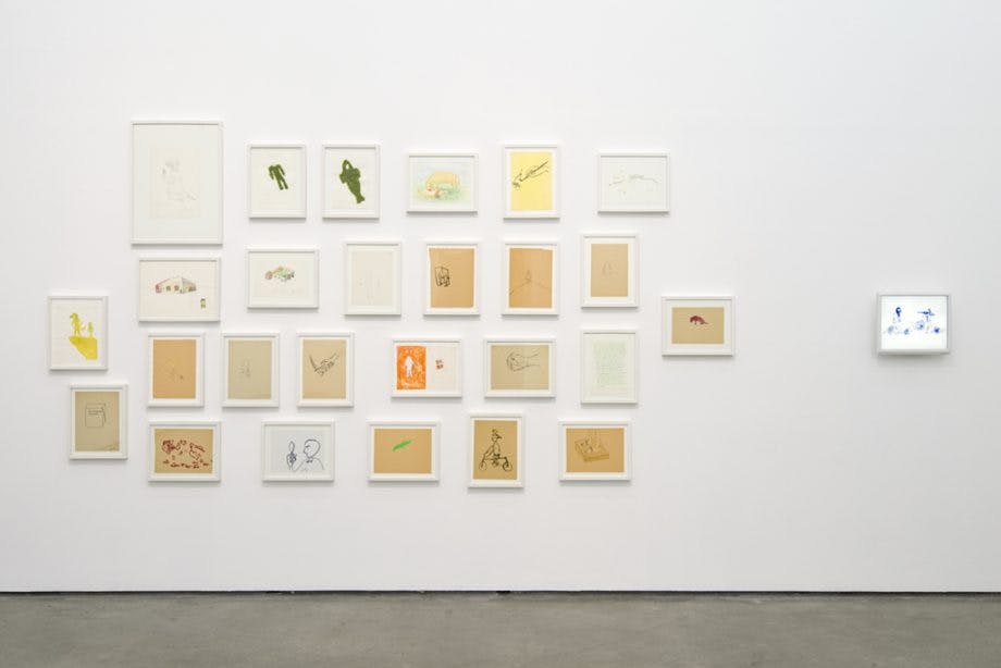 27 small-scale, framed drawings mounted on the gallery wall. Animals and human figures are rendered on shades of white and sand-colored paper. 