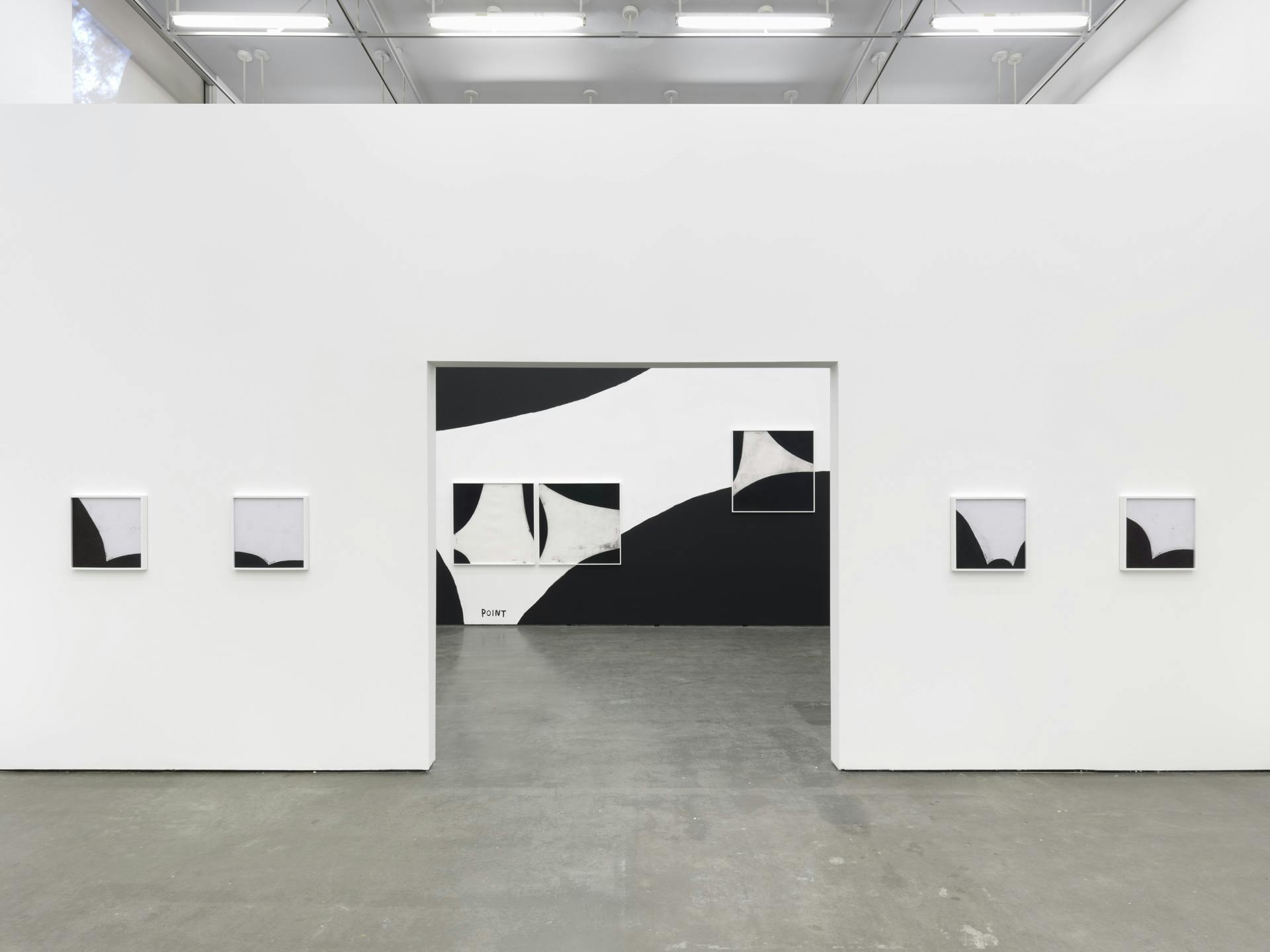 Four black and white drawings by Christine Sun Kim on a wall with an opening, through which a wall painting featuring the word "point" and three other drawings by Kim are visible.