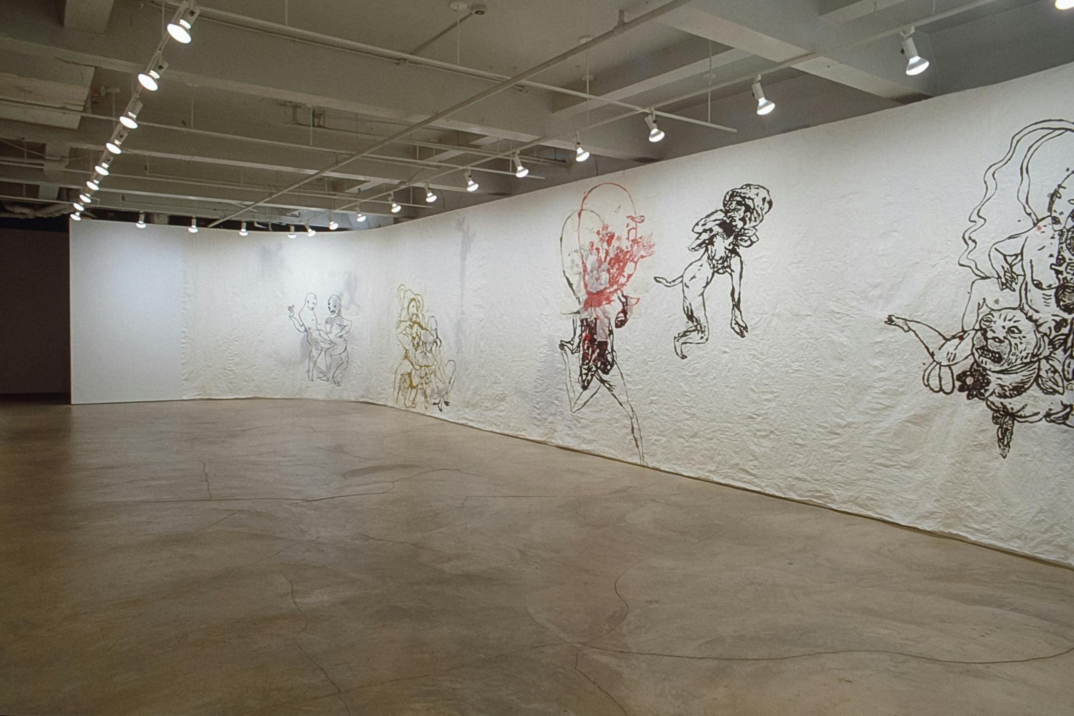 Inside the gallery, walls are covered by white scroll of paper, on which Ed Pien’s drawings are made. These drawings of human and animal figures are spaced out. Most of the lines are drawn in black. 