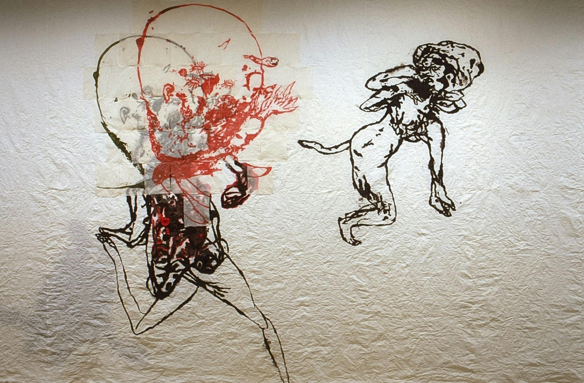 Detail of an artwork by Ed Pien. Two mythic figures, half humans and half undefinable animals, are drawin on paper. Red and black inks were used to draw these figures. 