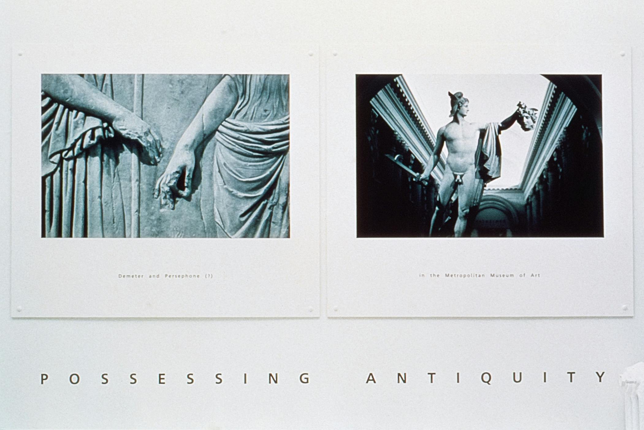 Two black and white prints pinned to a gallery wall. The prints show images of marble status with small printed text below. Beneath the image there is text that reads “POSSESSING ANTIQUITY.” 